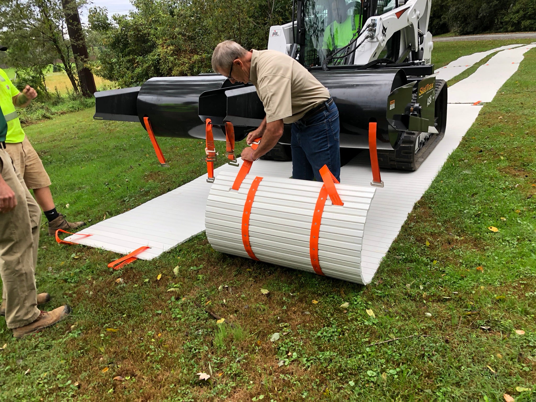 DICA SlatTrax hydraulic spool system demonstration laying a ground protection road