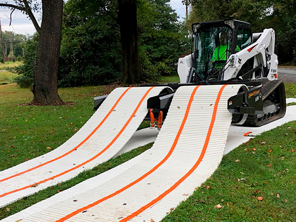 DICA SlatTrax adjustable-spread dual-spool hydraulic system deploying temporary roadway