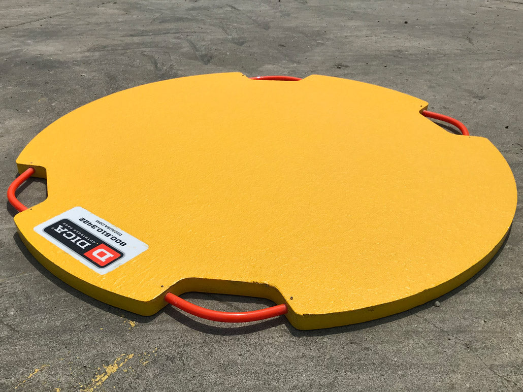 DICA FiberTech round FRP outrigger pad with TuffGrip handles supporting a boom truck outrigger float