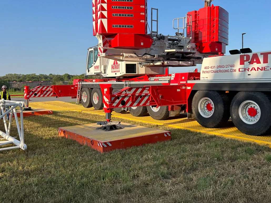 DICA FiberMax crane pads set up under all-terrain crane outriggers