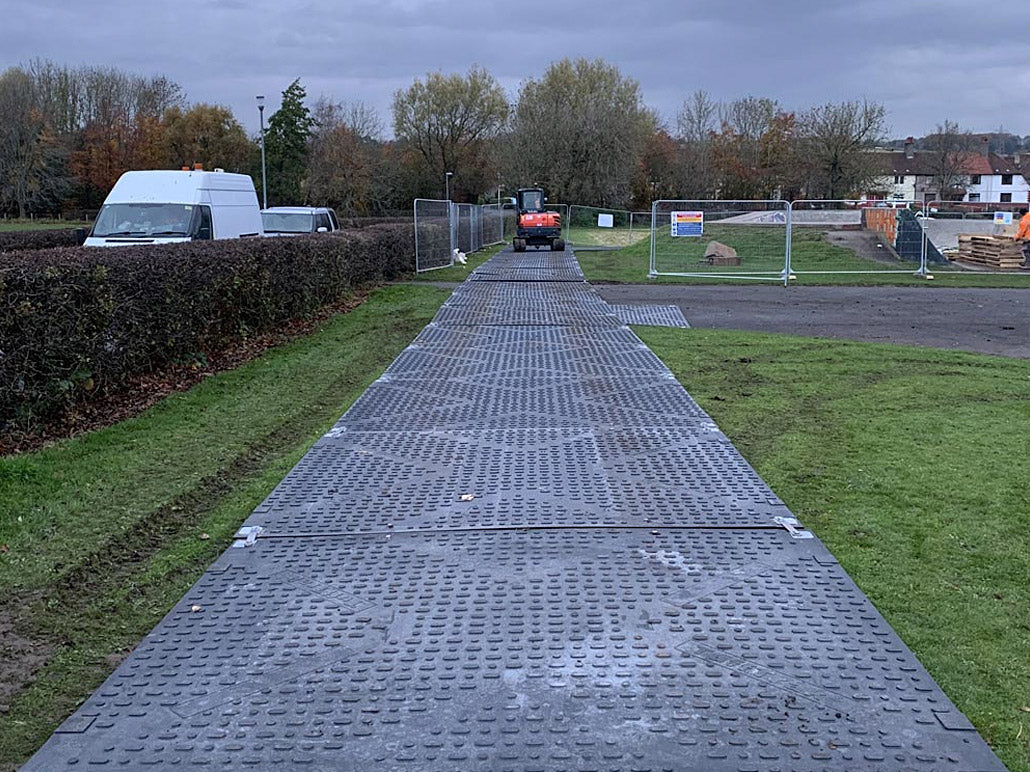 DICA TuffTrak XL access mats forming a temporary roadway on a heavy construction site